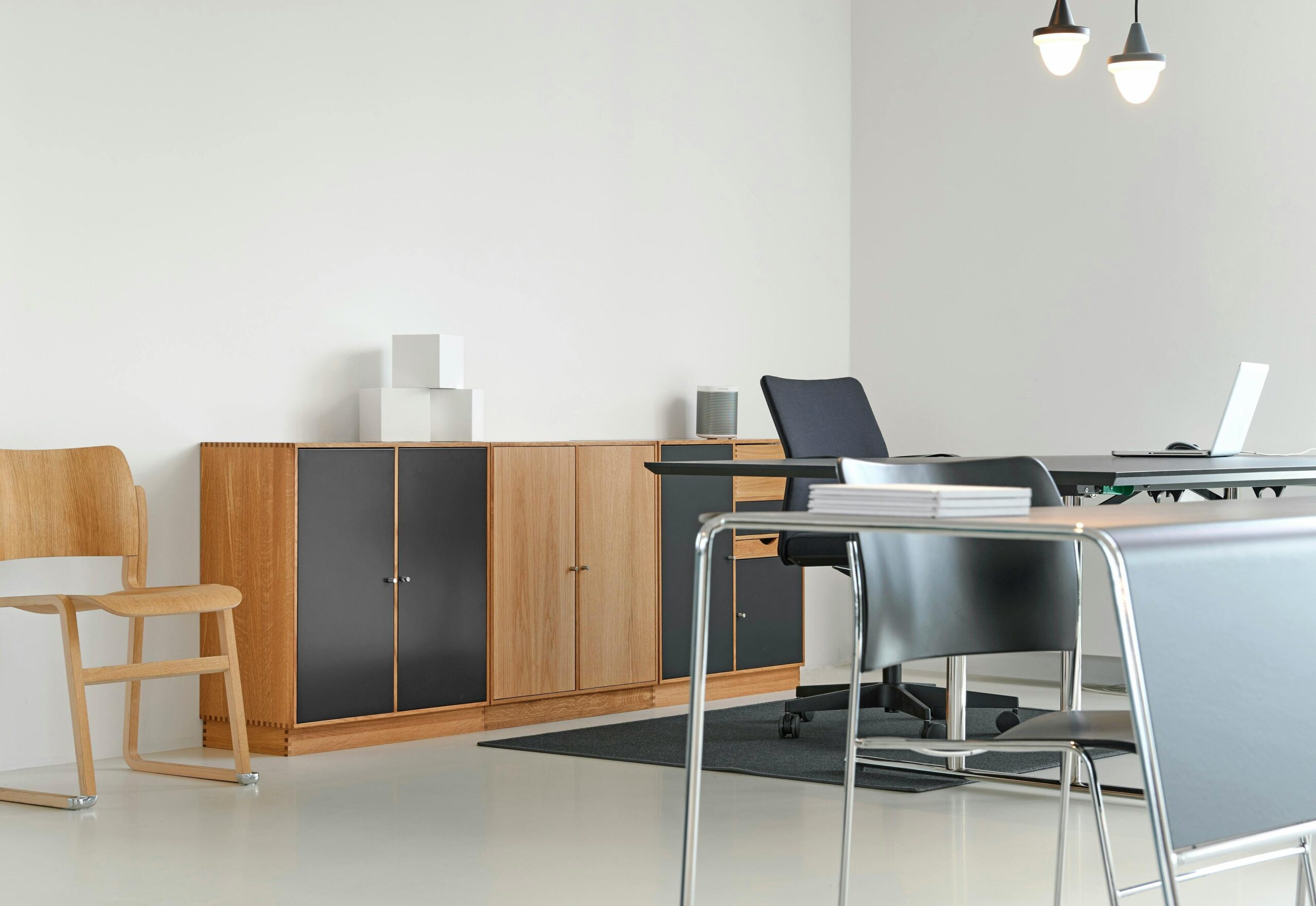 A clean and organized modern office space with stylish furniture and decor.